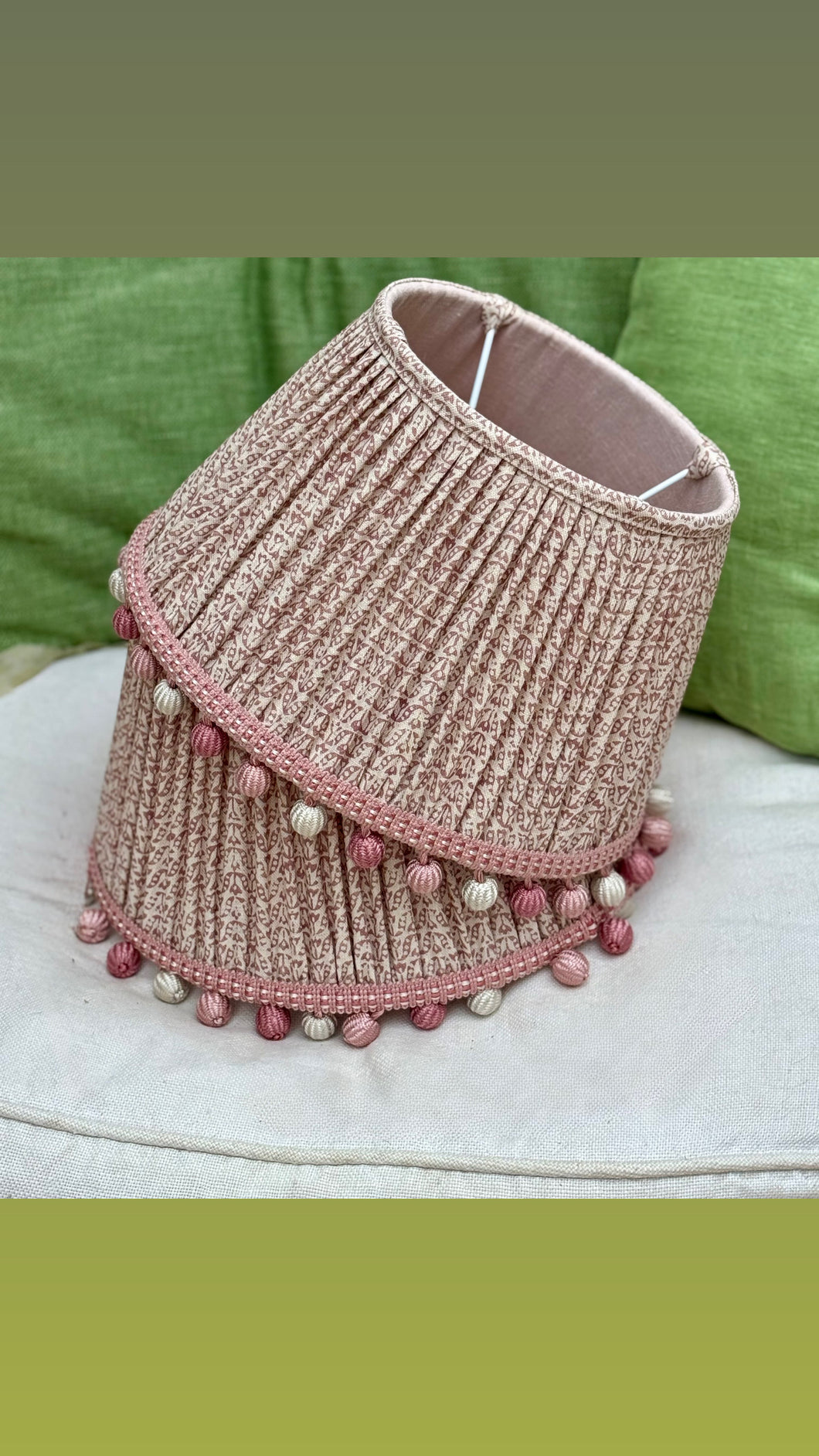A pair of 12” James Hare linen lampshades trimmed in beautiful James Hare drop trim